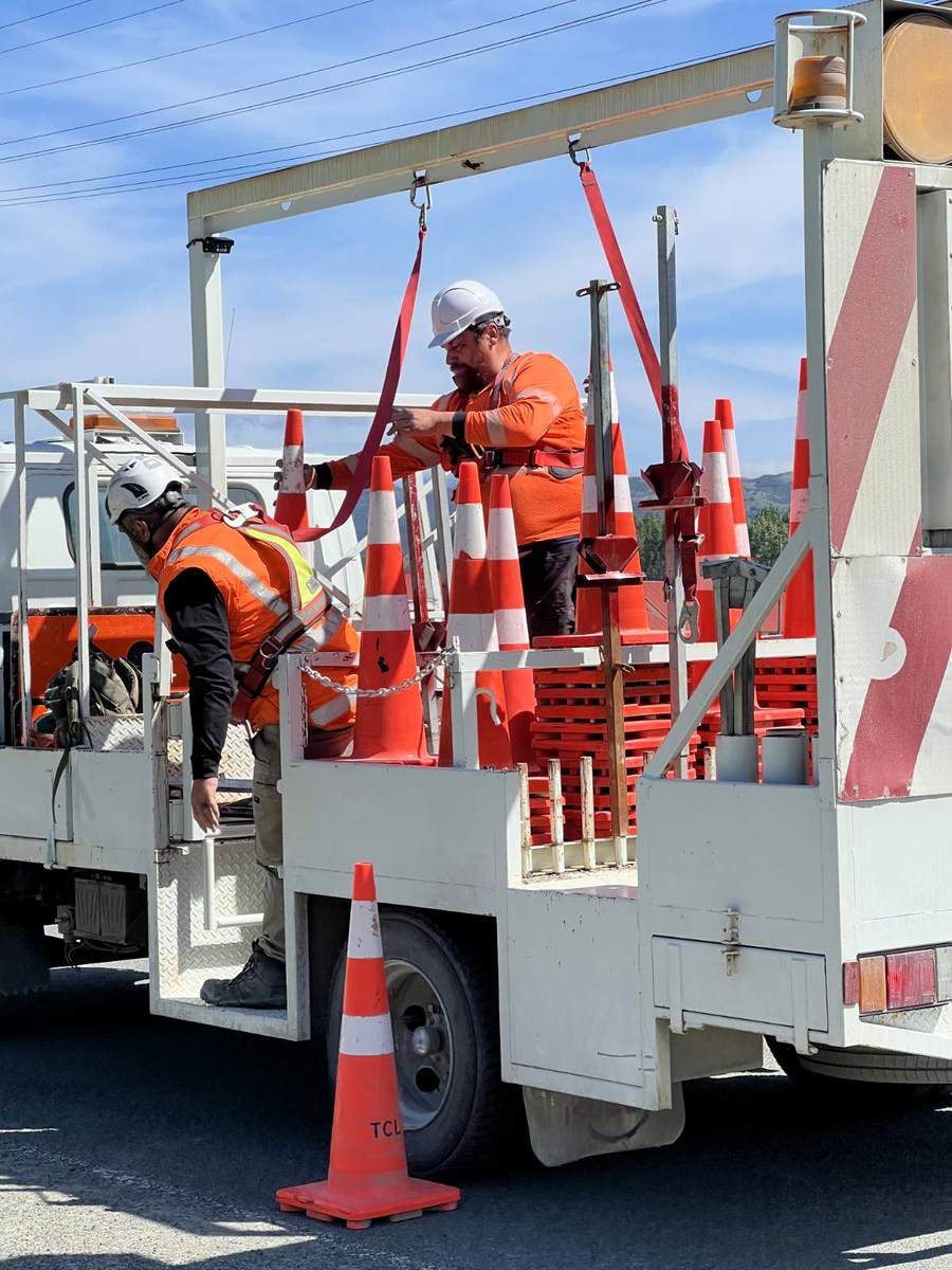 Tairāwhiti Contractors crew preparing traffic management equipment on a truck